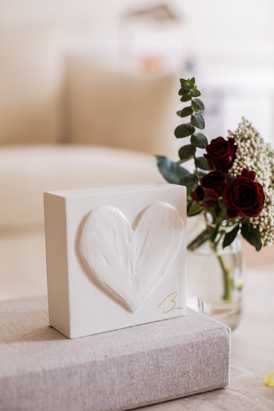 Warm Canvas heart sculpture — close-up of textured heart detail in warm cream canvas tone