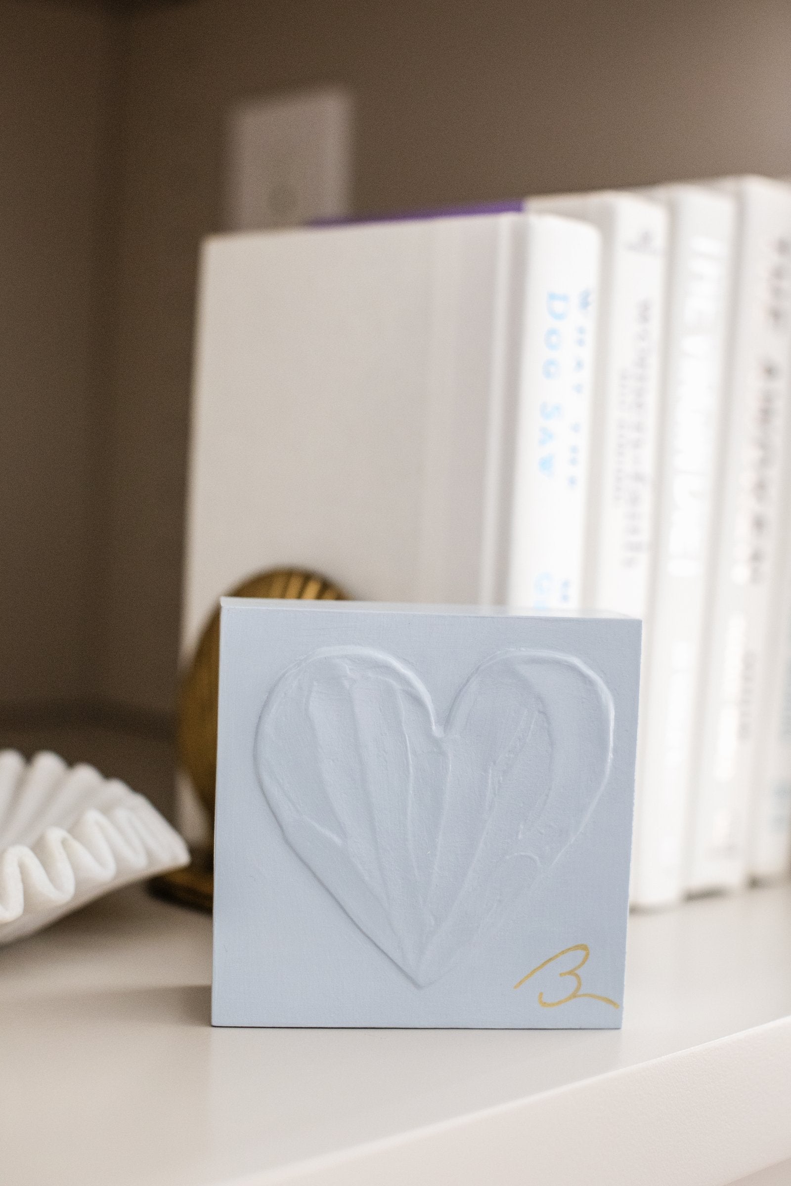 Blue Haze wood heart sculpture — close-up of hand sculpted heart showing cool blue-grey color