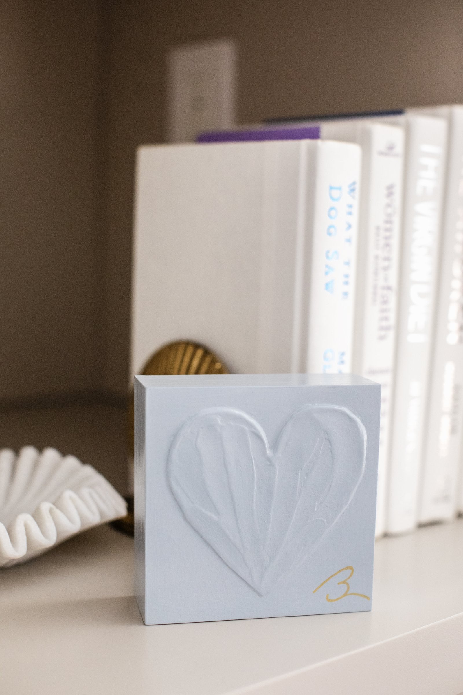 Blue Haze wood heart block — studio photo showing cool blue-grey blue tone with raised heart texture