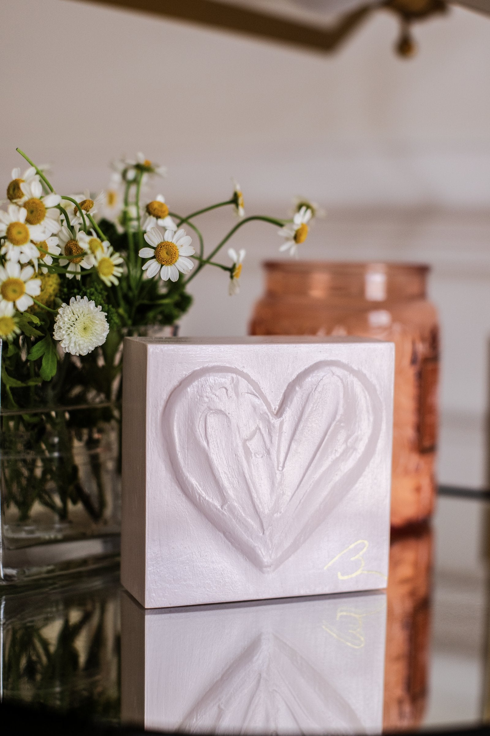 Delicate Pink heart sculpture — close-up of textured heart detail in soft Calamine pink