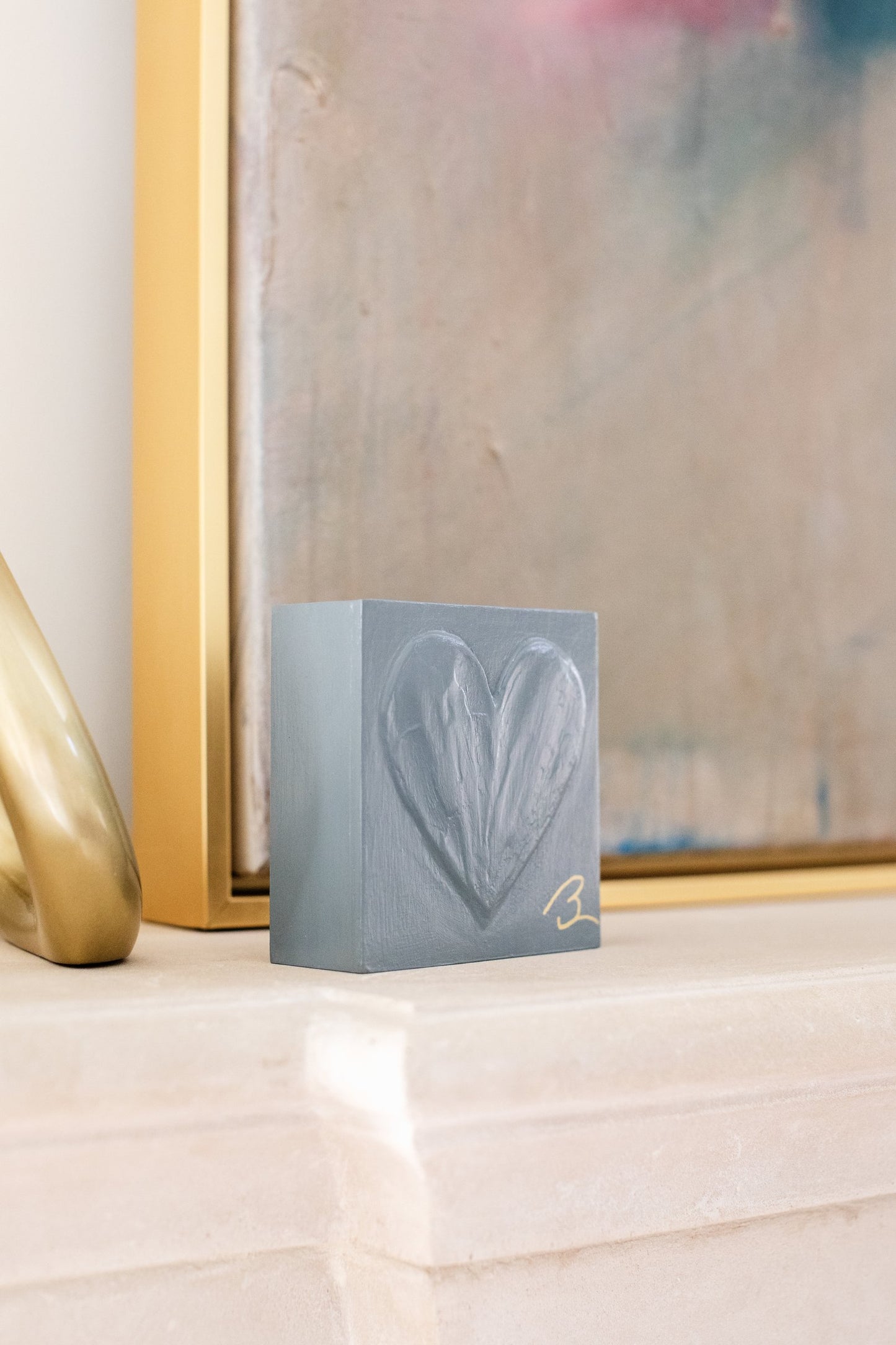 Grounded Blue wood heart block styled on shelf with lifestyle decor