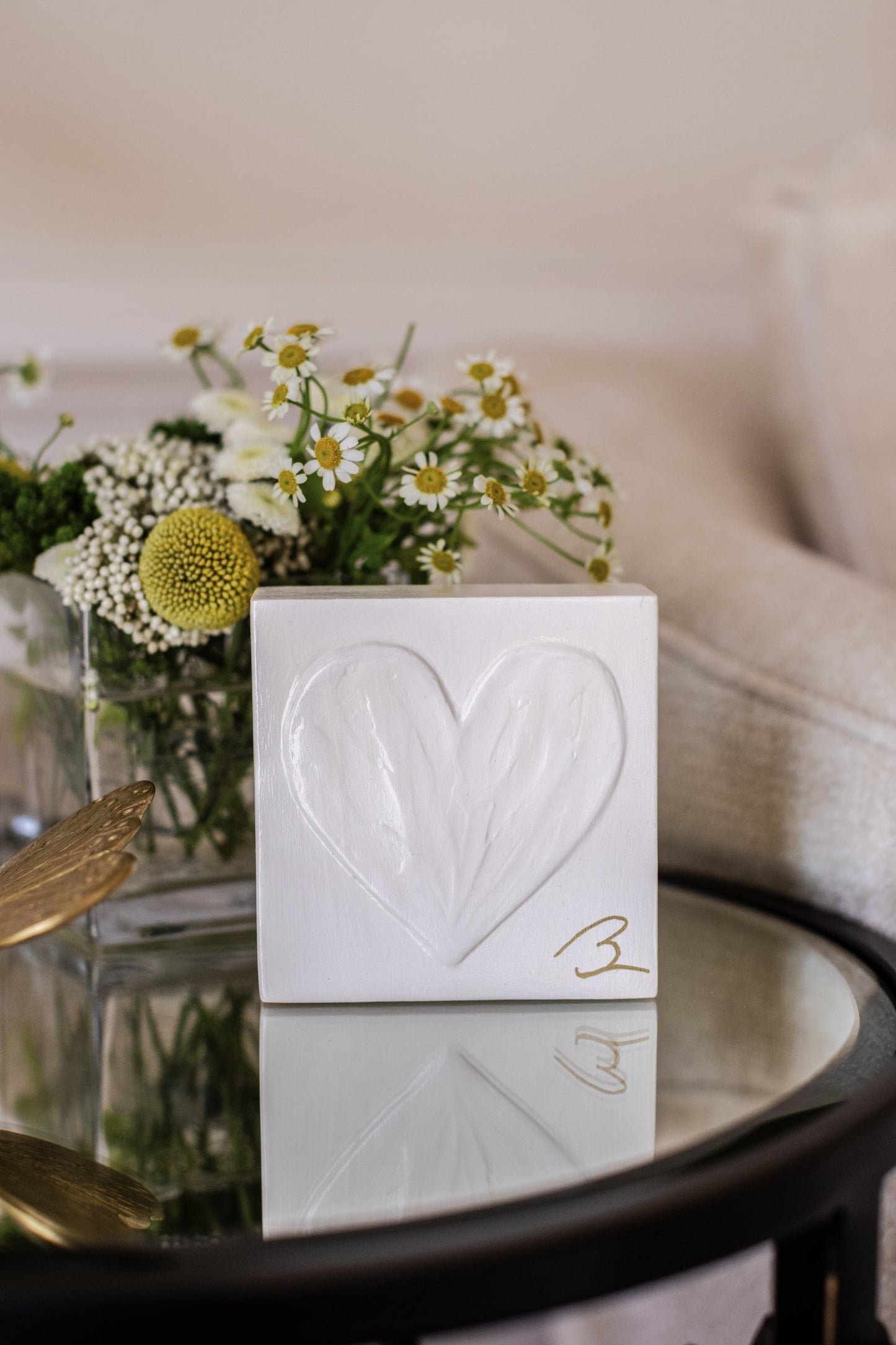 Sunlit White wood heart block — lifestyle setting showing bright white heart block in styled decor