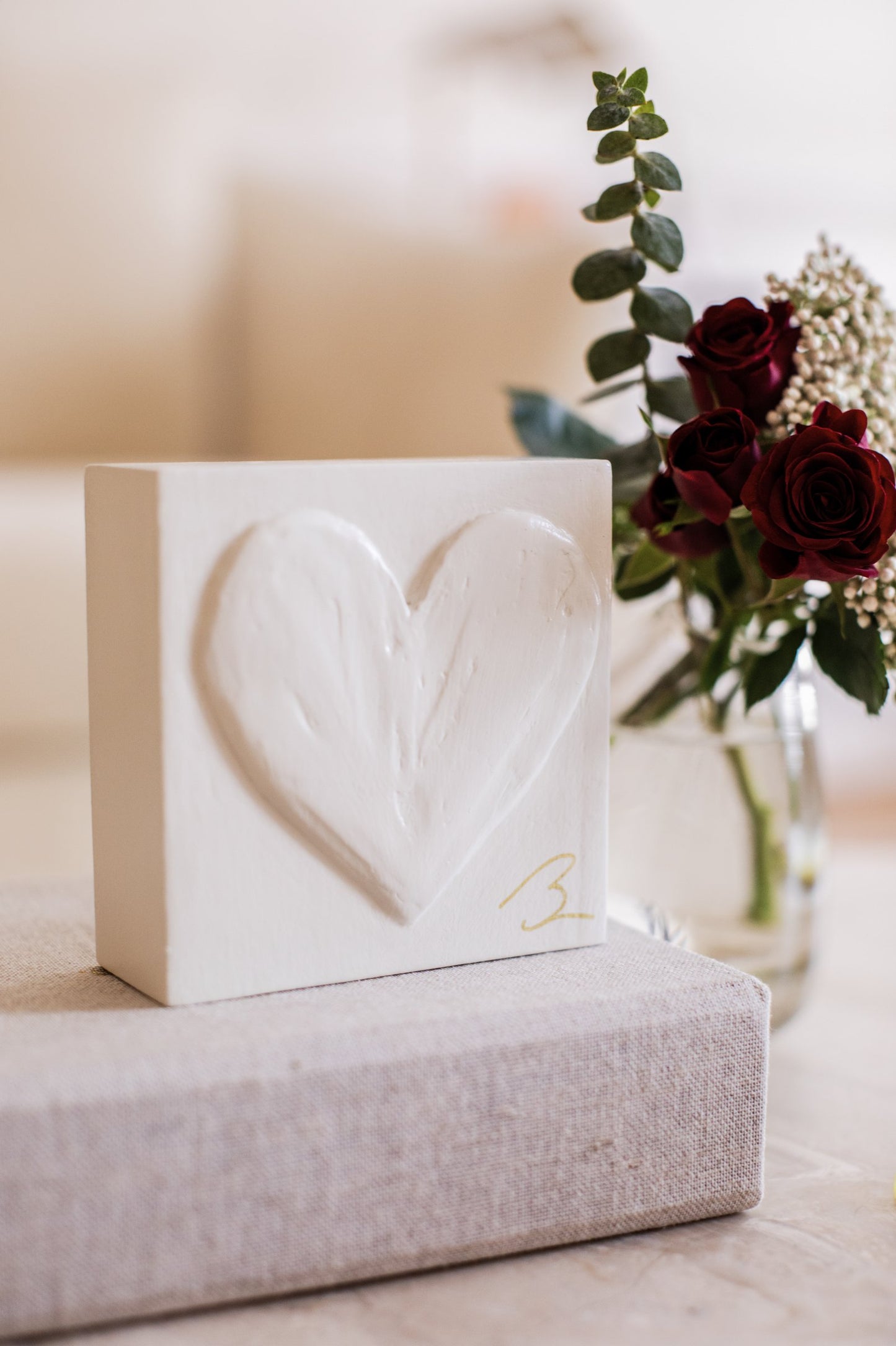 Warm Canvas hand sculpted heart — lifestyle setting showing warm neutral tone in styled decor